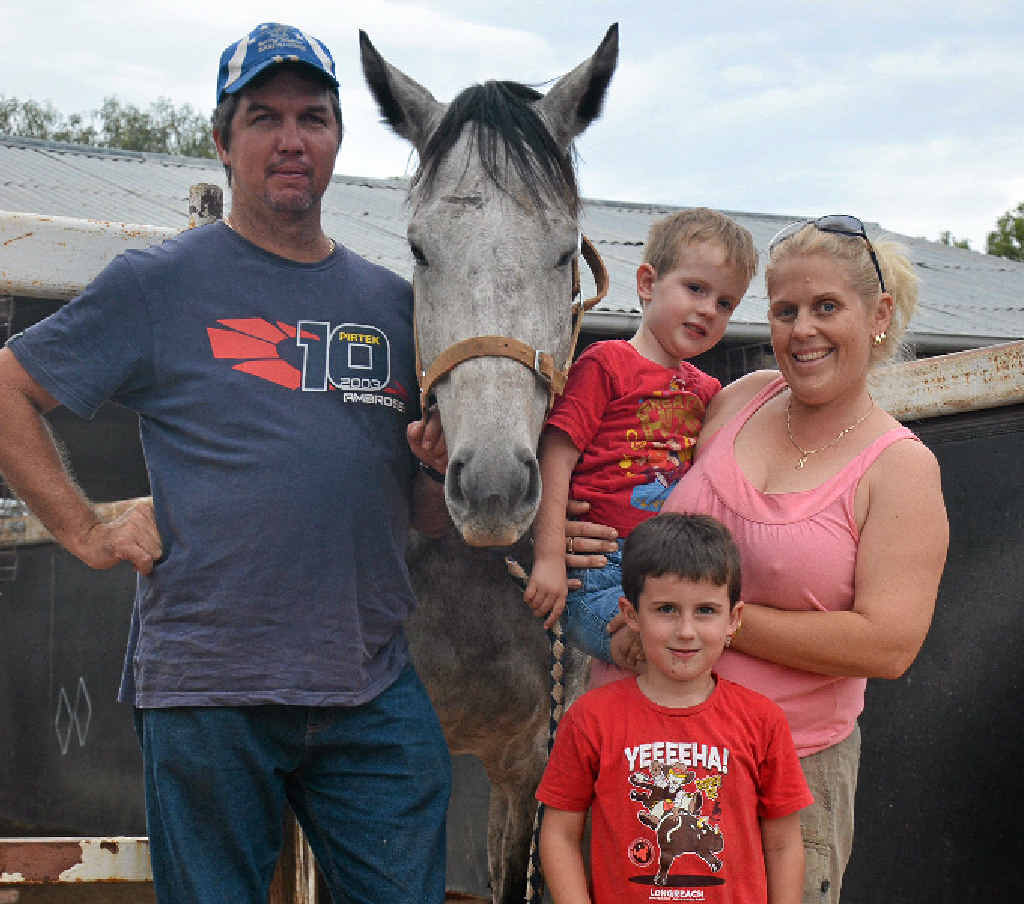 BACK HOME: Barcaldine horse trainer Todd Austin, his sons Tom and Toby, and wife Toni. BACK HOME: Barcaldine horse trainer Todd Austin, his sons Tom and Toby, and wife Toni.
